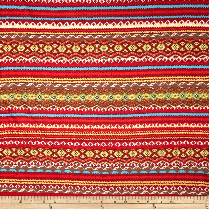 May include: Red, brown, yellow, and blue striped fabric with a geometric pattern. The fabric has a repeating pattern of stripes and geometric shapes.