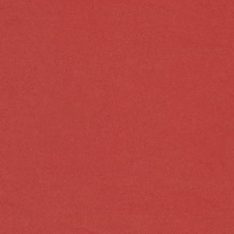 May include: A solid red fabric swatch. The fabric has a smooth, even texture.
