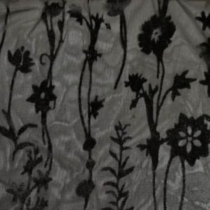 May include: Black floral pattern on a sheer gray fabric. The flowers are stylized and have a vintage feel.