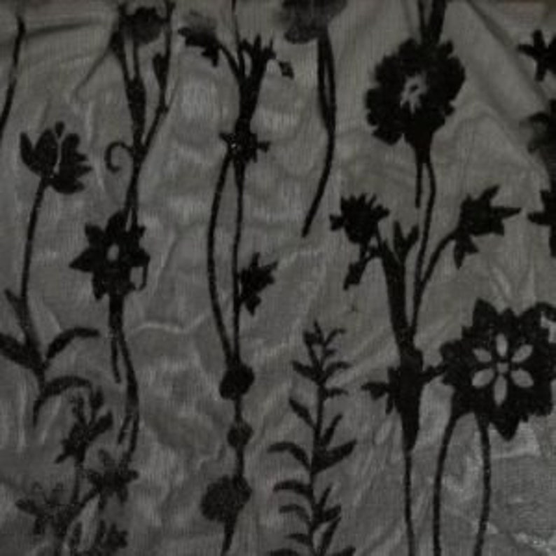 May include: Black floral pattern on a sheer gray fabric. The flowers are stylized and have a vintage feel.