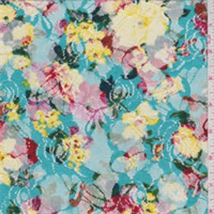 May include: Teal blue fabric with a floral print featuring pink, yellow, and green flowers. The fabric has a textured, lace-like appearance.