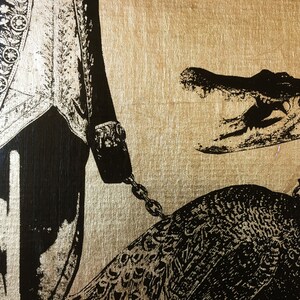 May include: A black and gold illustration of a man in a formal outfit holding a chain attached to a peacock with an alligator head.