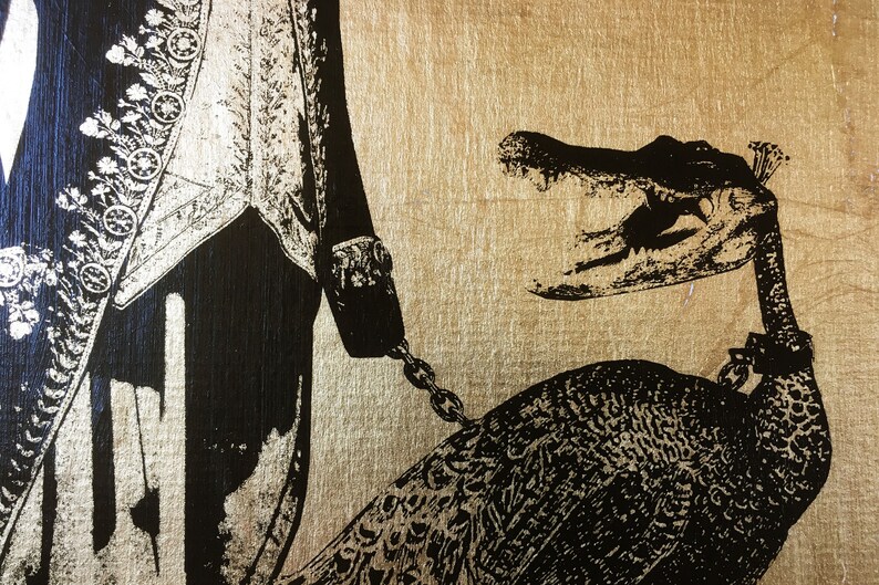 May include: A black and gold illustration of a man in a formal outfit holding a chain attached to a peacock with an alligator head.