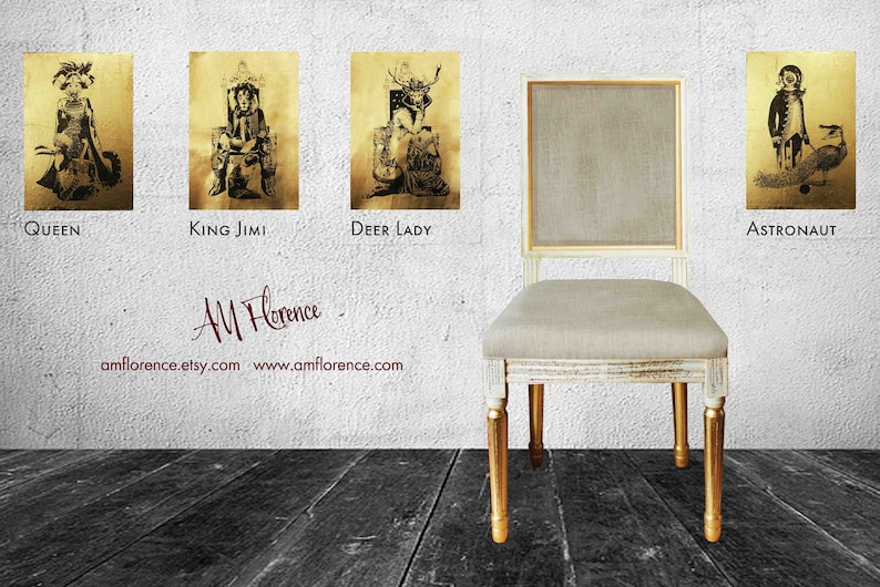 May include: Four framed illustrations of fantasy characters, including a queen, a king, a deer lady, and an astronaut, are displayed on a white wall. A white chair with gold legs sits in front of the wall. The chair is upholstered in a light beige fabric. The text "AM Florence" is written in cursive on the wall below the illustrations. The text "amflorence.etsy.com www.amflorence.com" is written below the cursive text.