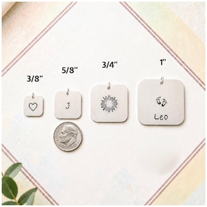 May include: Four square silver-toned metal charms with jump rings, labeled 3/8 inch, 5/8 inch, 3/4 inch, and 1 inch. The charms feature a heart, the letter J, a sunburst design, and baby footprints with the name Leo. A US coin is shown for scale.