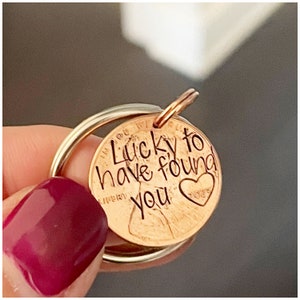 May include: A copper penny keychain with the words "Lucky to have found you" engraved on it. A small heart with the word "yours" is engraved below the text.