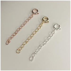 May include: Three extender chains for necklaces or bracelets. The chains are made of metal and are available in silver, gold, and rose gold.