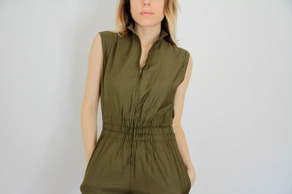 dark green jump suit