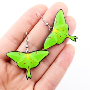 Luna moth earrings in vivid green with witchy gothic style