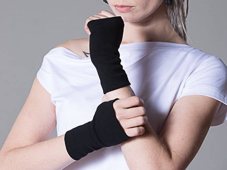 May include: A pair of black fingerless gloves. The gloves are made of a soft, stretchy fabric and are perfect for keeping your hands warm in the winter.