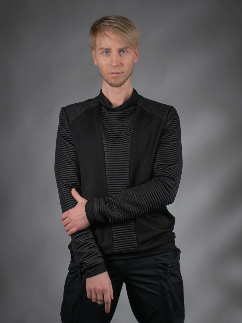 Man in black SP sweater with ribbed sleeves, front view – futuristic menswear