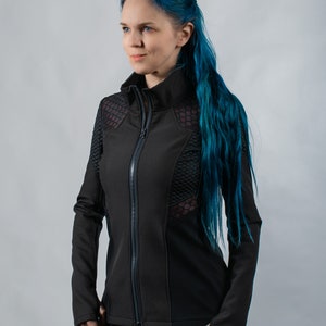 May include: A black zip-up jacket with mesh panels and a high collar. The jacket is worn by a person with blue hair.