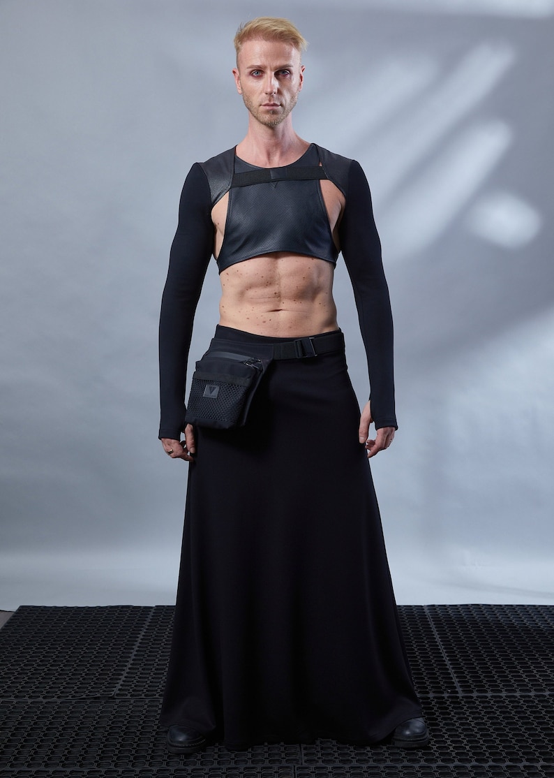 Man in black SK-L skirt with cropped harness top – dark avant-garde cosplay