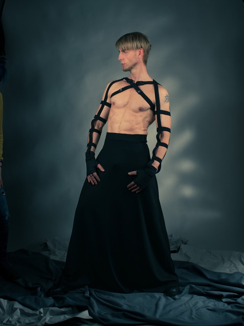 Man wearing black SK-L maxi skirt with strap harness – avant-garde men's skirt