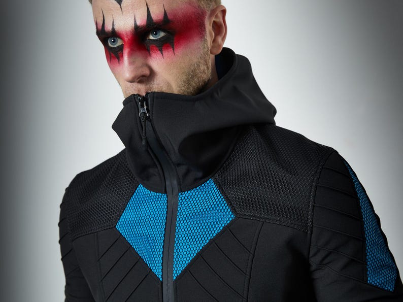 May include: A black zip-up jacket featuring a high collar, a hood, and bright blue mesh panels on the chest and shoulders. The garment includes quilted detailing on the sleeves and torso, with a central zipper closure extending to the neck.
