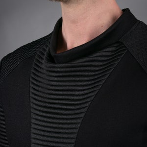 Black SP sweater high cowl neck and ribbed panel, close-up