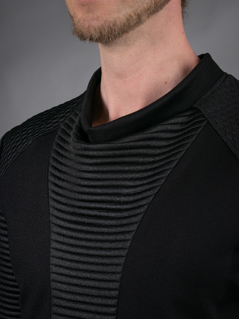 Black SP sweater high cowl neck and ribbed panel, close-up