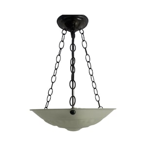 May include: A black ceiling light fixture with a white glass shade and three chains hanging from the fixture.
