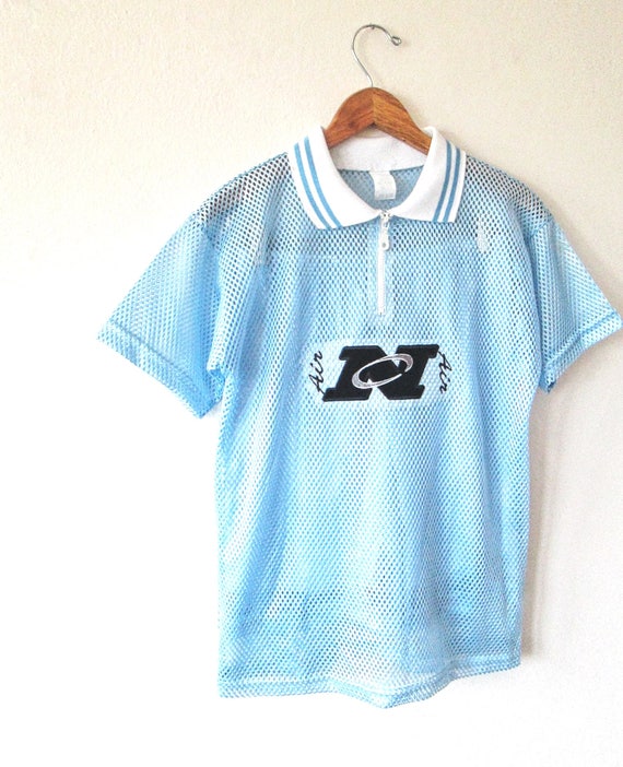 white and baby blue nike shirt