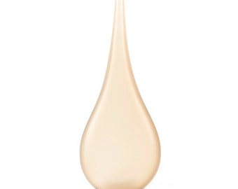 May include: A teardrop-shaped vase made of glass with a light beige color.