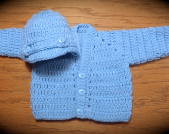 001. Baby boy's V-neck sweater sets in light blue with newsboy hats.