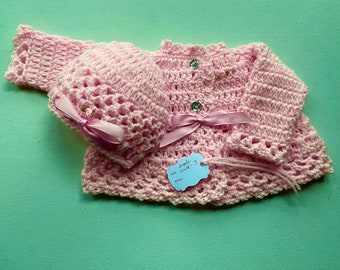004. Baby girl sweater, crocheted, lacy, matching hat, adjustable waist and hat, Adorable, well-made.
