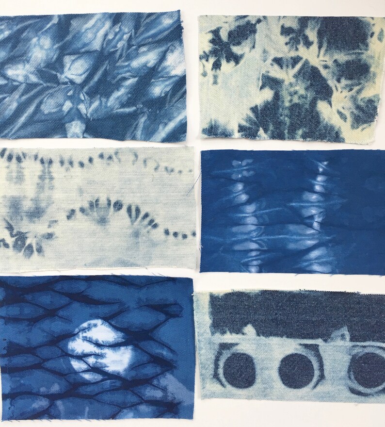 May include: Six fabric squares in various shades of blue with different tie-dye patterns. The fabric is a light blue denim.