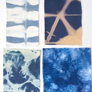 May include: Four fabric swatches with different blue tie-dye patterns. The swatches are arranged in a grid pattern on a white background.