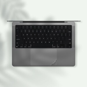 a black and white photo of a laptop keyboard