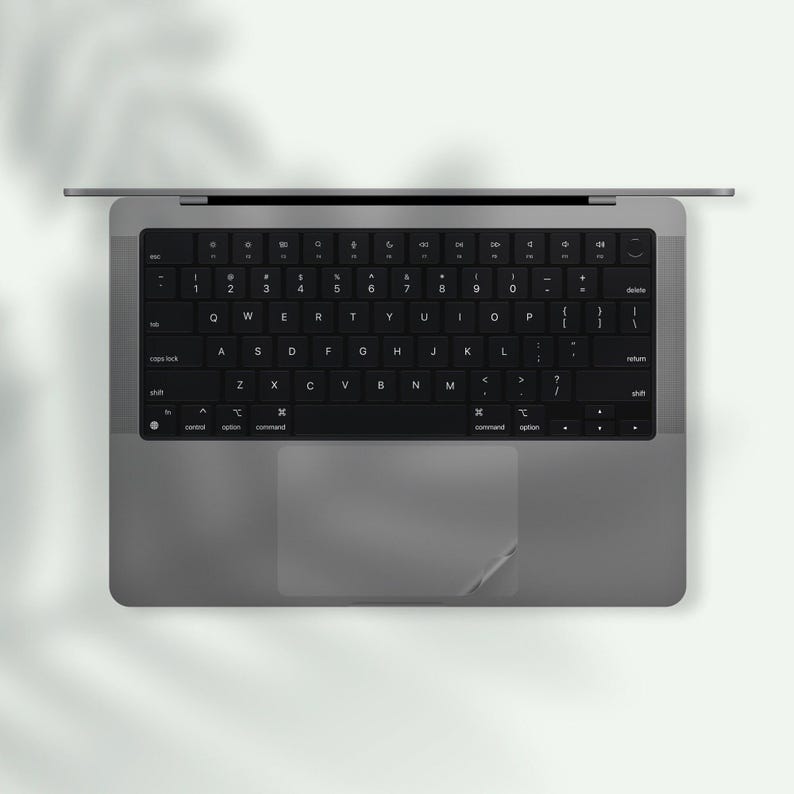 a black and white photo of a laptop keyboard