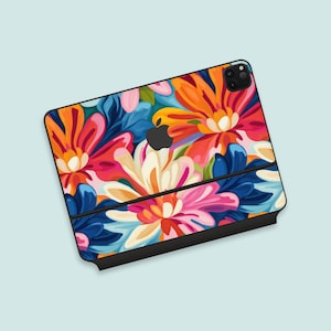 May include: A colorful floral phone case with a black border and a cutout for the camera lens. The flowers are painted in shades of red, orange, yellow, pink, blue, and green.