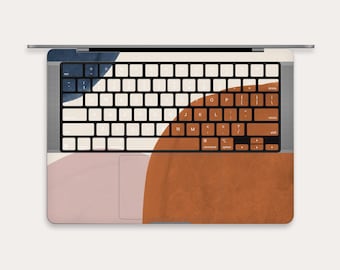 May include: A laptop computer with a keyboard and trackpad. The laptop has a colourful abstract design with shades of blue, pink, and orange.