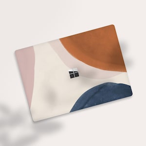 May include: Abstract laptop skin with a white background and overlapping shapes in shades of pink, orange, and blue.
