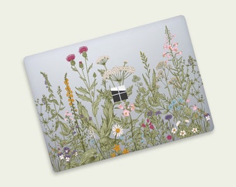 May include: A laptop skin with a floral design featuring a variety of wildflowers in shades of pink, purple, yellow, and green on a light blue background.