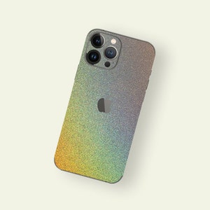 May include: A rainbow glitter phone case for an iPhone. The case has a subtle gradient of colors, starting with yellow at the bottom and transitioning to blue at the top. The case is made of a durable material and is designed to protect your phone from scratches and bumps.