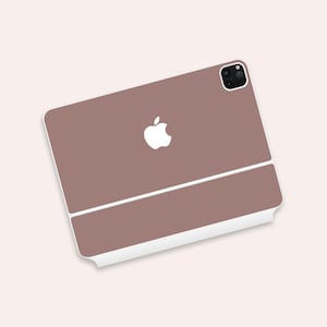 May include: A brown phone case with a white Apple logo and a camera lens cutout.