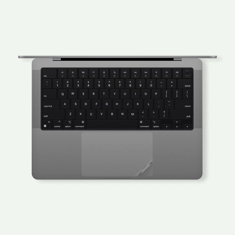 a black and white photo of a laptop keyboard
