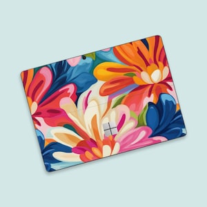 May include: A colourful floral design with pink, orange, yellow, blue and white flowers on a tablet skin.