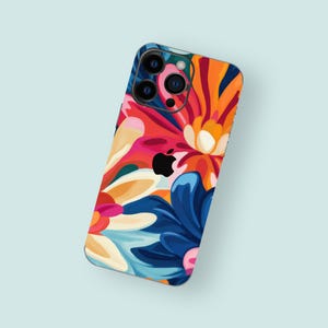 May include: A colorful phone case with a floral design featuring blue, red, orange, and white flowers. The case has a cutout for the camera lens.