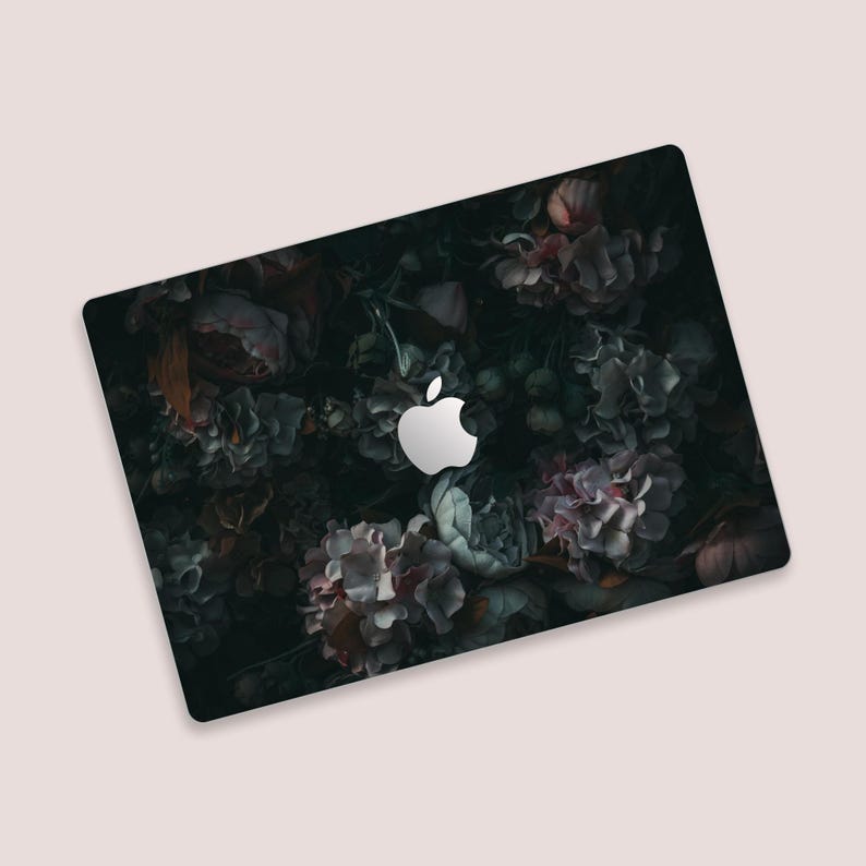 a computer mouse pad with an apple logo on it