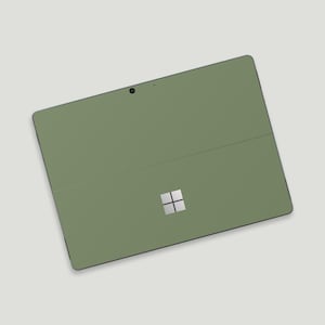 May include: A green Microsoft Surface tablet with a silver Microsoft logo.