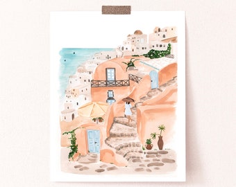 May include: A watercolor painting of a white building with a blue door and a woman walking up a set of stairs. The building is surrounded by other buildings and there is a view of the ocean in the background.