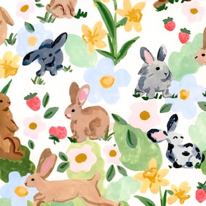 May include: A whimsical pattern featuring watercolor illustrations of bunnies, flowers, and strawberries. The bunnies are in various shades of brown, gray, and white, amidst blue, yellow, and pink flowers, and green foliage, all set against a white background.