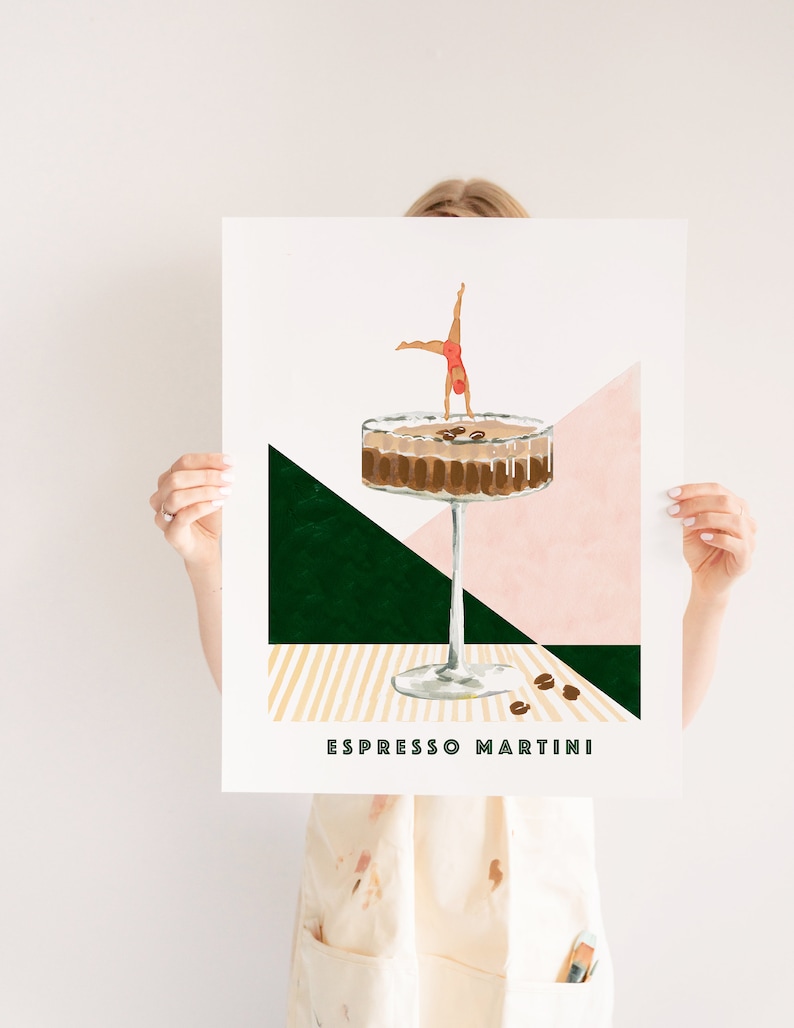 May include: A digital illustration of an espresso martini cocktail with a woman doing a handstand in the drink. The background is a geometric pattern of pink, green, and yellow.