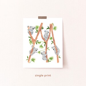 May include: A digital print featuring a whimsical illustration of five koalas climbing on tree branches. The koalas are depicted in shades of gray, while the branches are brown and the leaves are green.