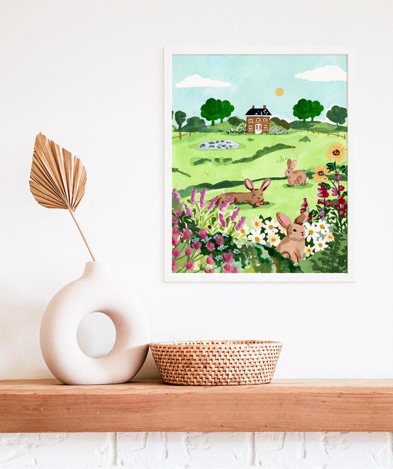 May include: A watercolor painting of a green field with a small red brick house, a pond, and three brown rabbits. The field is filled with colorful flowers and green bushes. The sky is blue with white clouds and a bright yellow sun.