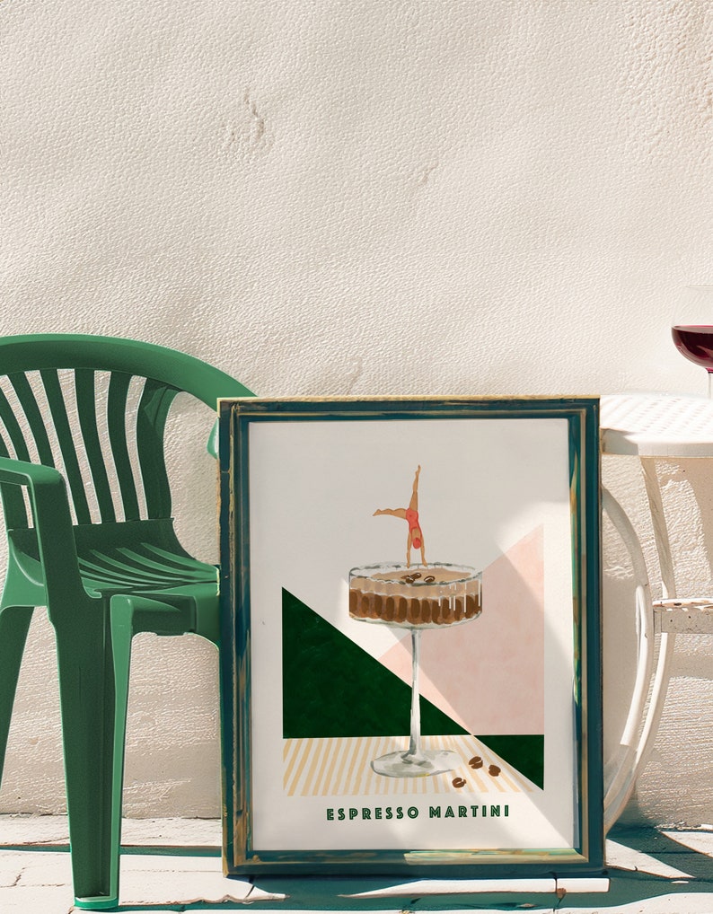 May include: A framed print with a green, pink, and yellow geometric design. A martini glass with coffee beans and a woman diving into the glass is depicted. The text "Espresso Martini" is at the bottom of the print.