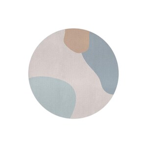 May include: A round rug with an abstract design. The rug features a light gray background with soft blue and tan organic shapes. The rug is a modern home decor item.