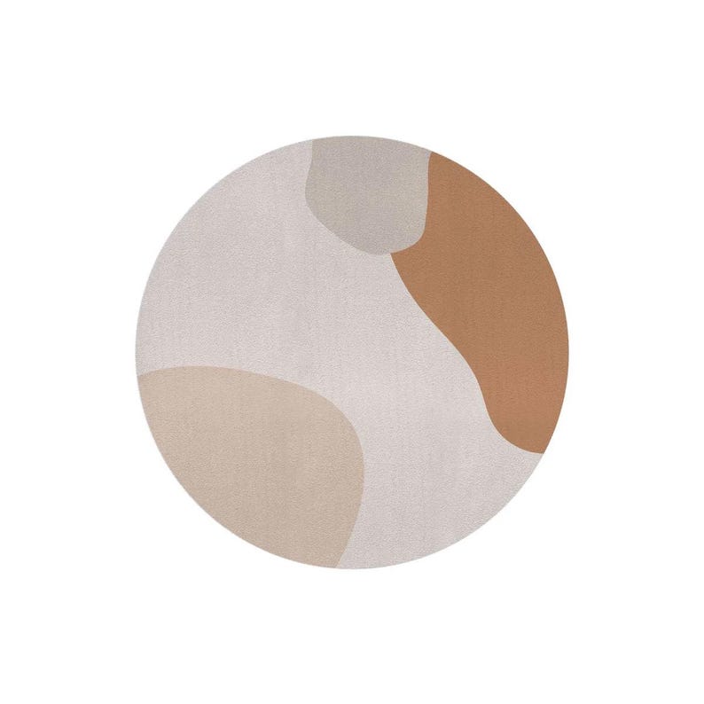 May include: A round rug with an abstract design. The rug features a neutral color palette with beige, tan, and brown organic shapes against a light gray background. The rug is a soft floor covering.
