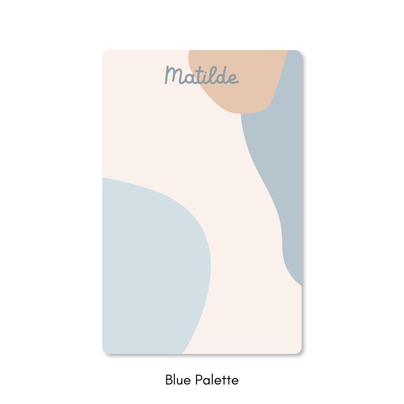 May include: A rectangular card with a soft, abstract design. The card features a light beige background with blue and peach-colored organic shapes. The word "Matilde" is written in a light gray script at the top. The text "Blue Palette" is at the bottom.